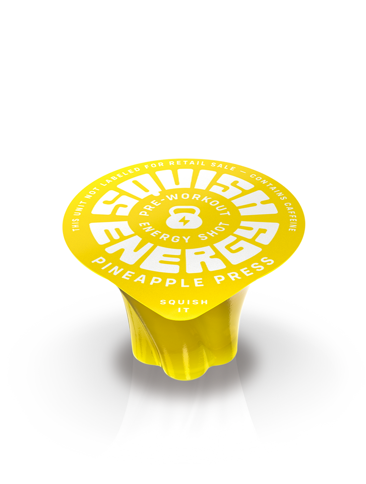 One Pineapple Press pre-workout shot in a small yellow container, made by Squish Energy.
